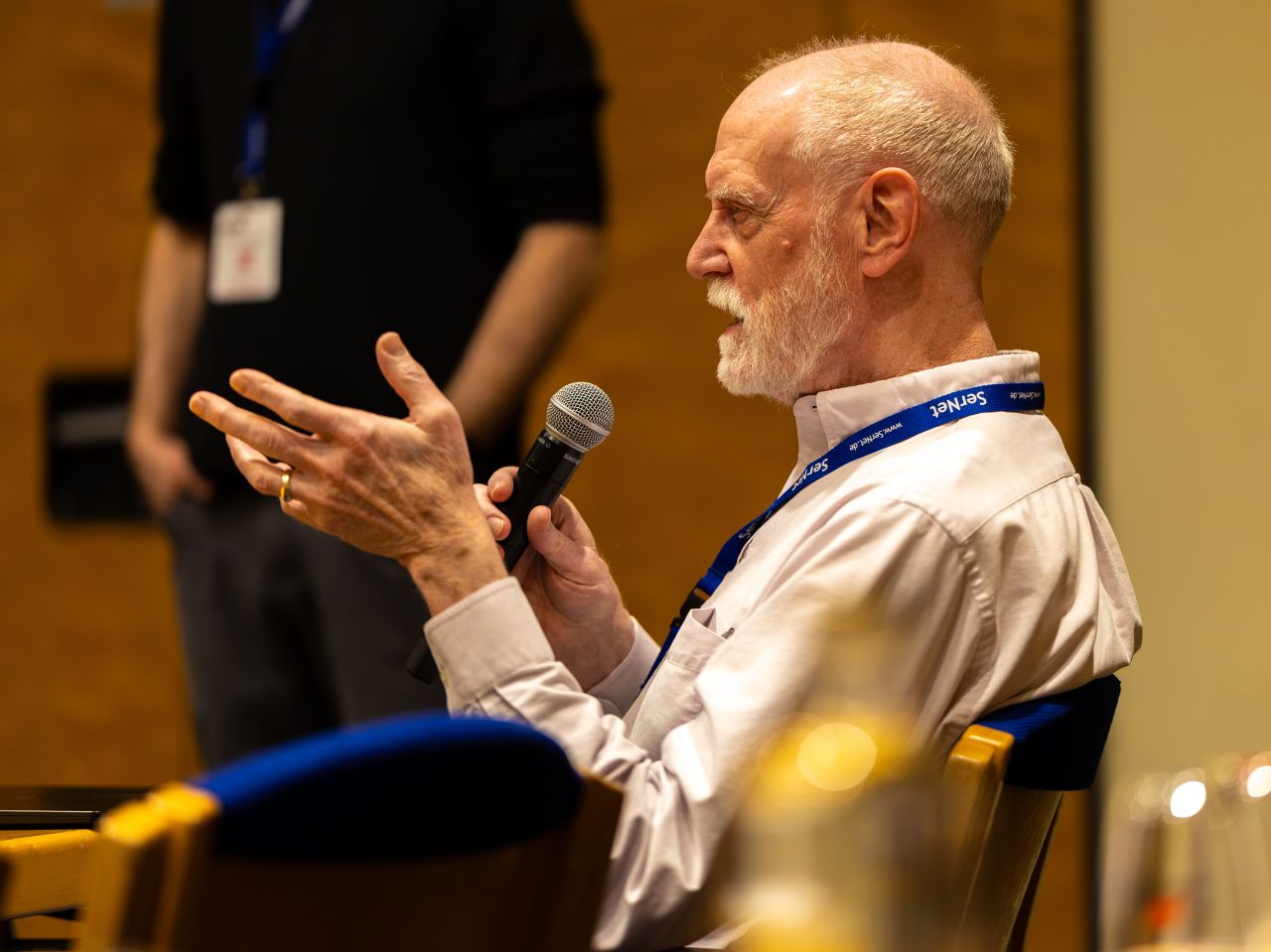 Tom Talpey speaking into a microphone during a SambaXP discussion
